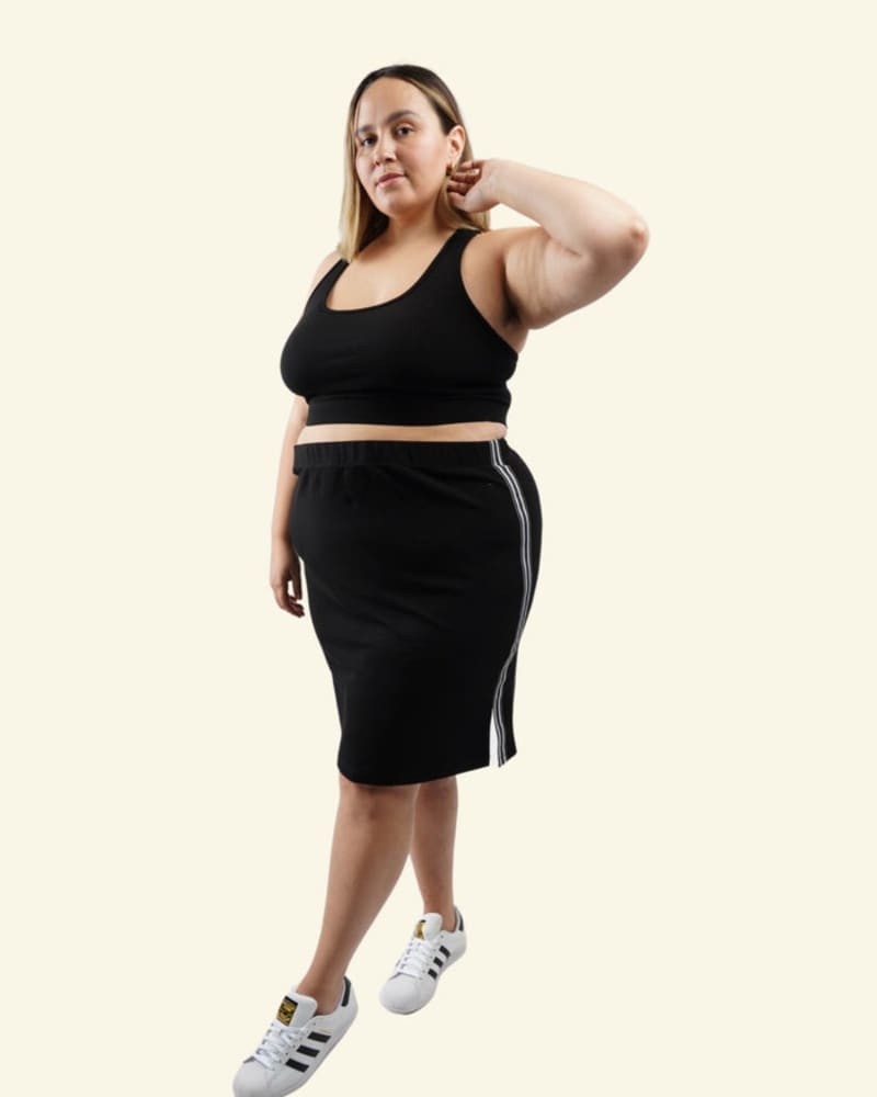 Front of a model wearing a size L Sequoia Skirt in Black by Reprise Activewear. | dia_product_style_image_id:254074